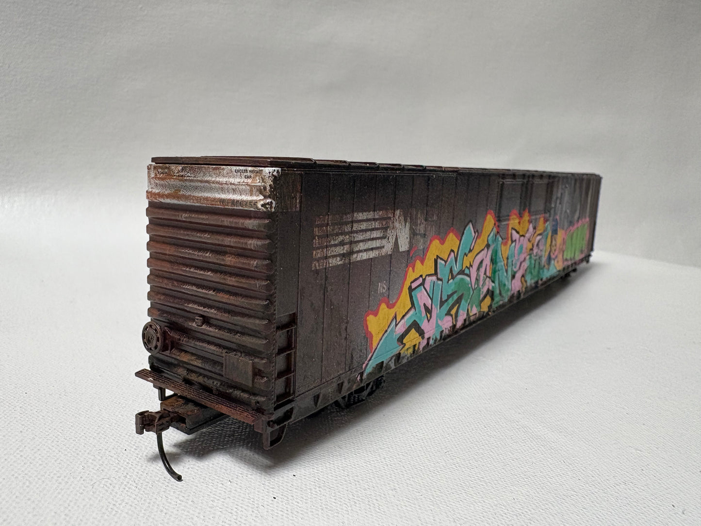 Miniature Model Railroad car and background.